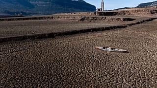 An abandoned kayak lies on the cracked ground at the Sau reservoir, which is only at 5 percent of its capacity, in Vilanova de Sau, about 100 km (62 miles) north of Barcelona,