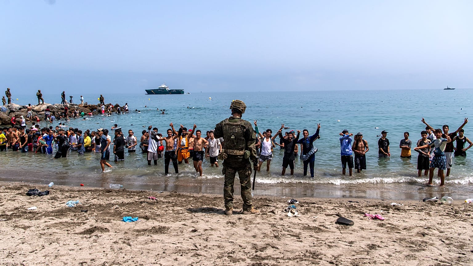 Spanish army soldiers block access to the beach for people crossing from Morocco into the Spanish enclave of Ceuta, Friday, 31 July 2026.