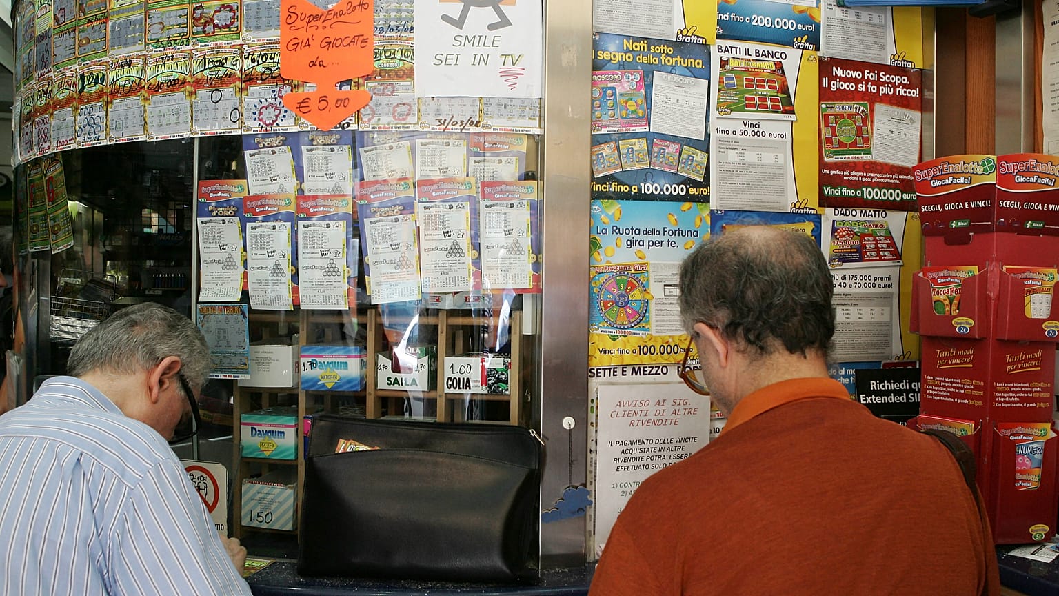 People queuing to play SuperEnalotto in Milan, Italy, on Tuesday 18 August 2009.