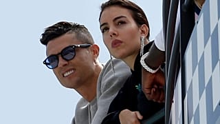 Cristiano Ronaldo, on the left, and his partner Georgina Rodriguez attend the second practice session at the Monaco circuit in Monaco on 23 May 2019.