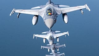 A Romanian Air Force F-16 military fighter jet and Portuguese Air Force F-16s participating in NATO's Baltic Air Policing Mission over the Baltic Sea on 22 May, 2023. 