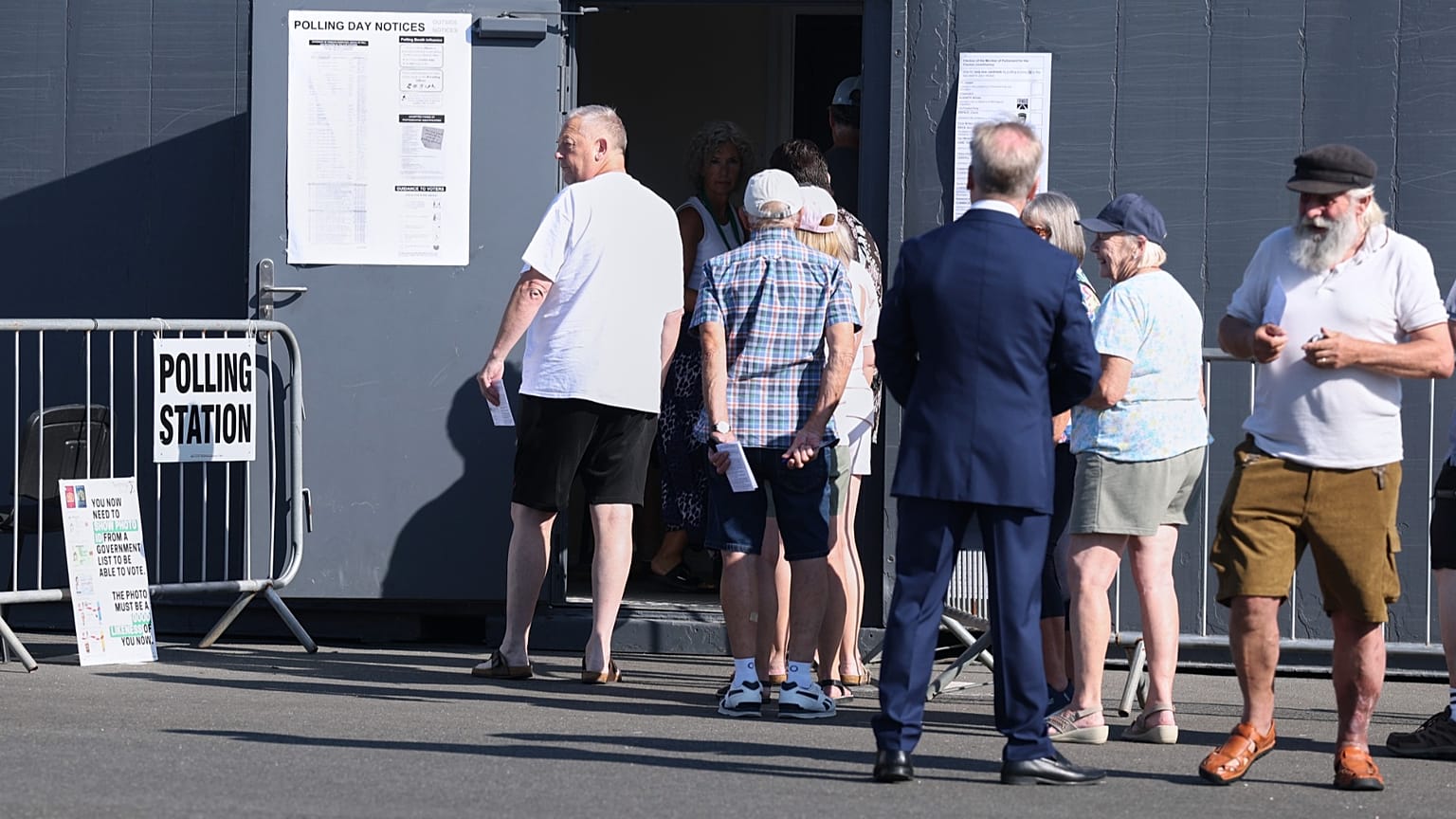 Voters queue at a polling station in Walton on the Naze, 13 August, 2026