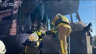 Emergency services work on the destroyed train carriage in Odesa