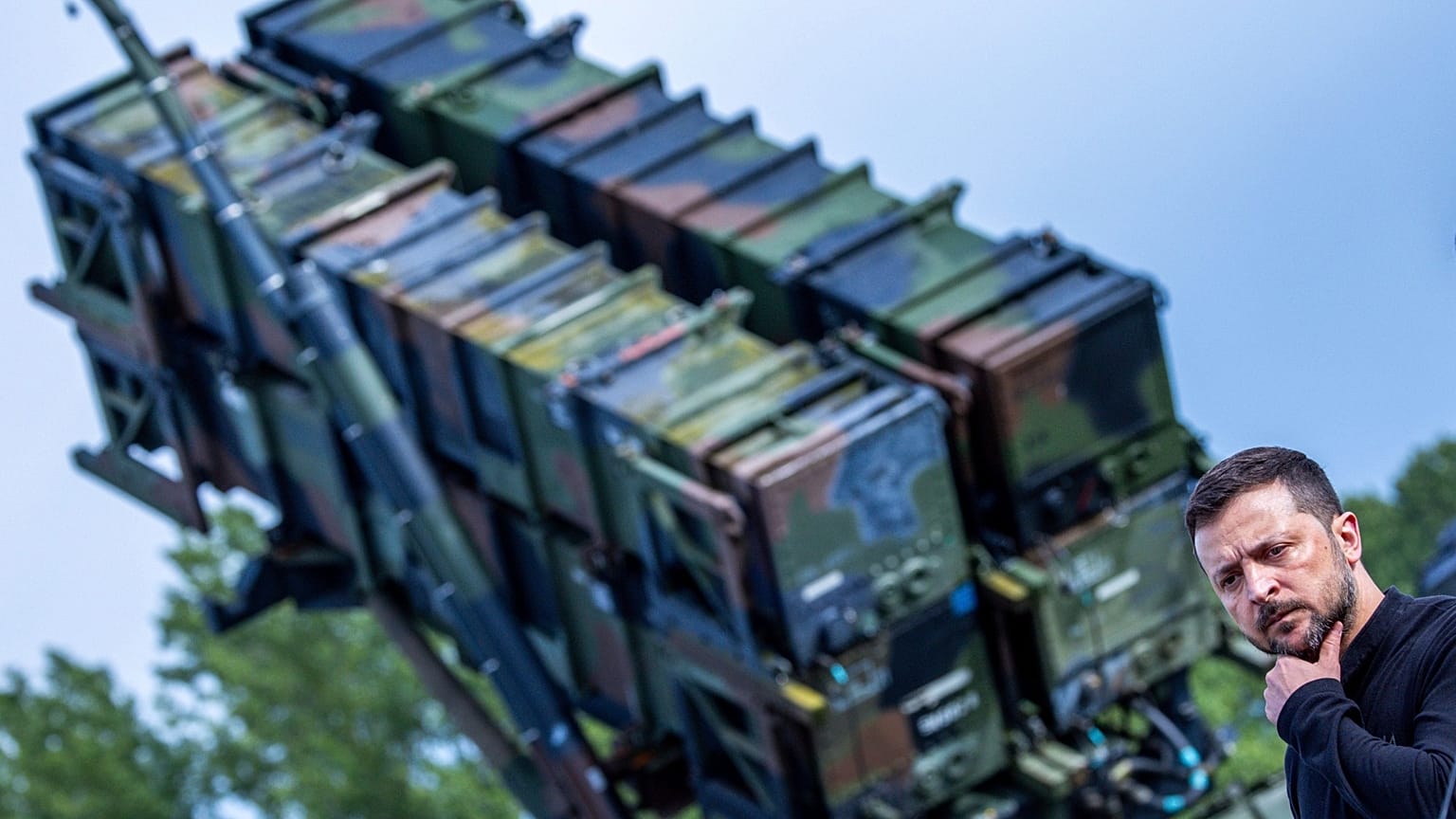 Ukraine's President Volodymyr Zelenskyy stands in front of a Patriot air defence missile system during a visit to a military training area in Western Pomerania, 11 June, 2024