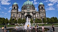 As temperatures rise in Berlin, people cool off in a fountain in front of the cathedral on Thursday 30 July 2026. (AP Photo/Ebrahim Noroozi)