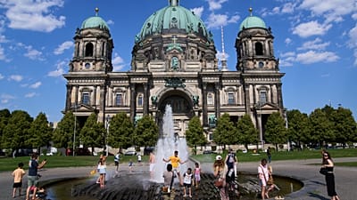 As temperatures rise in Berlin, people cool off in a fountain in front of the cathedral on Thursday 30 July 2026. (AP Photo/Ebrahim Noroozi)