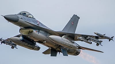 A Royal Danish Air Force jet flies during the NATO military exercises Crystal arrow 2022 at the Adazi military range, Latvia, Friday, March 11, 2022.